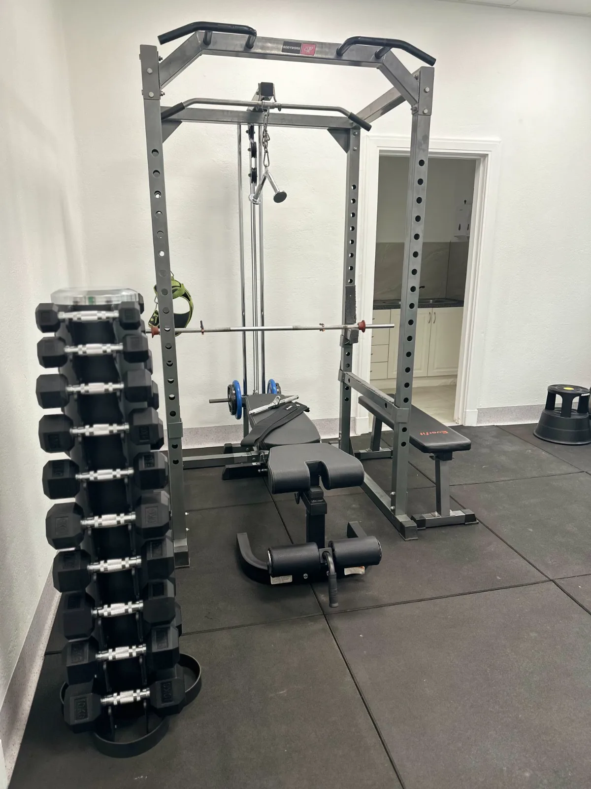 A power rack, bench and dumbbell tree in the Adelaide Health Group exercise room